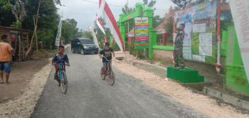 Sekarang Jalan TMMD Bojonegoro Jatimulyo Sudah Mulus, Anak-Anak Bisa Main Sepeda Dengan Santai